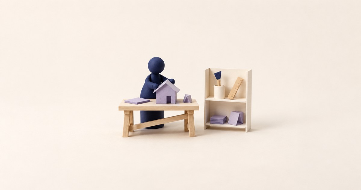 作品を作る駒の机の横に、必要な道具を揃えた小棚を置いた紙模型